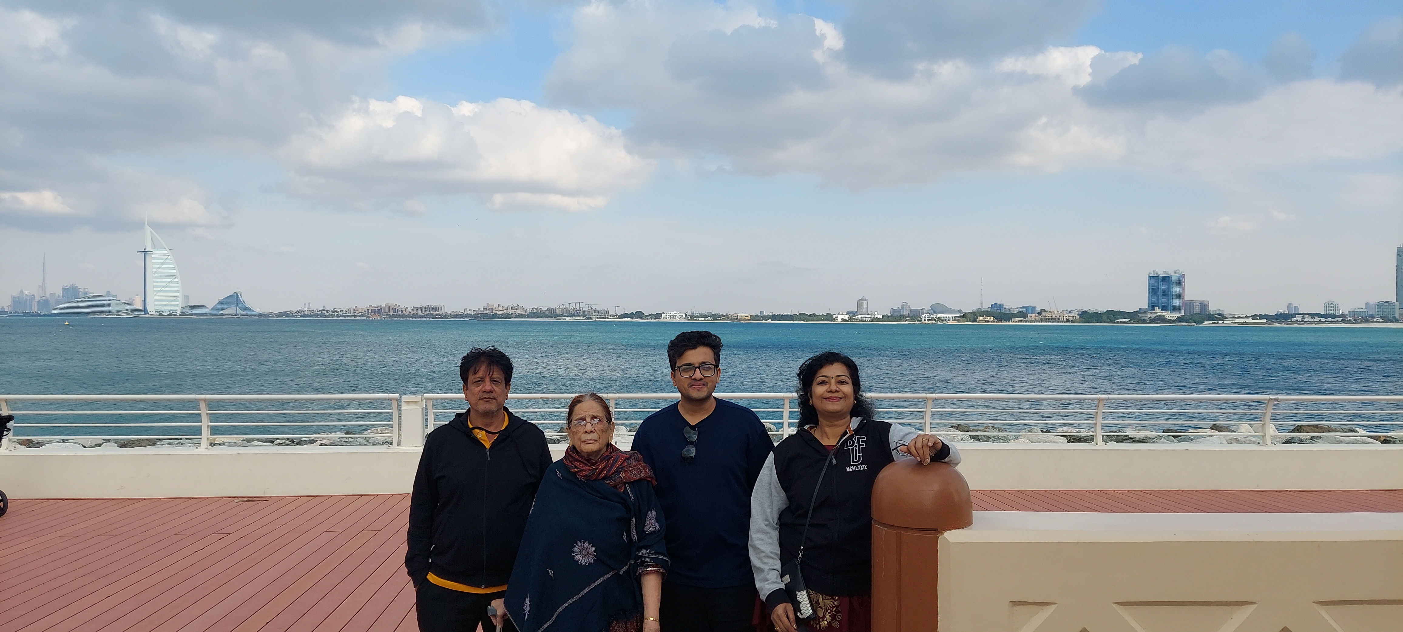 Family in Dubai with Burj Al Arab